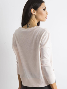 Jasnoróżowy sweter z dekoltem w serek 